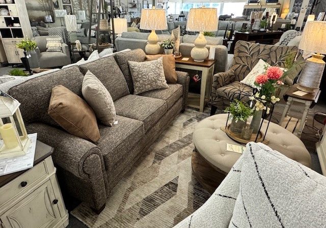 Contemporary living room set with sectional sofa and coffee table.